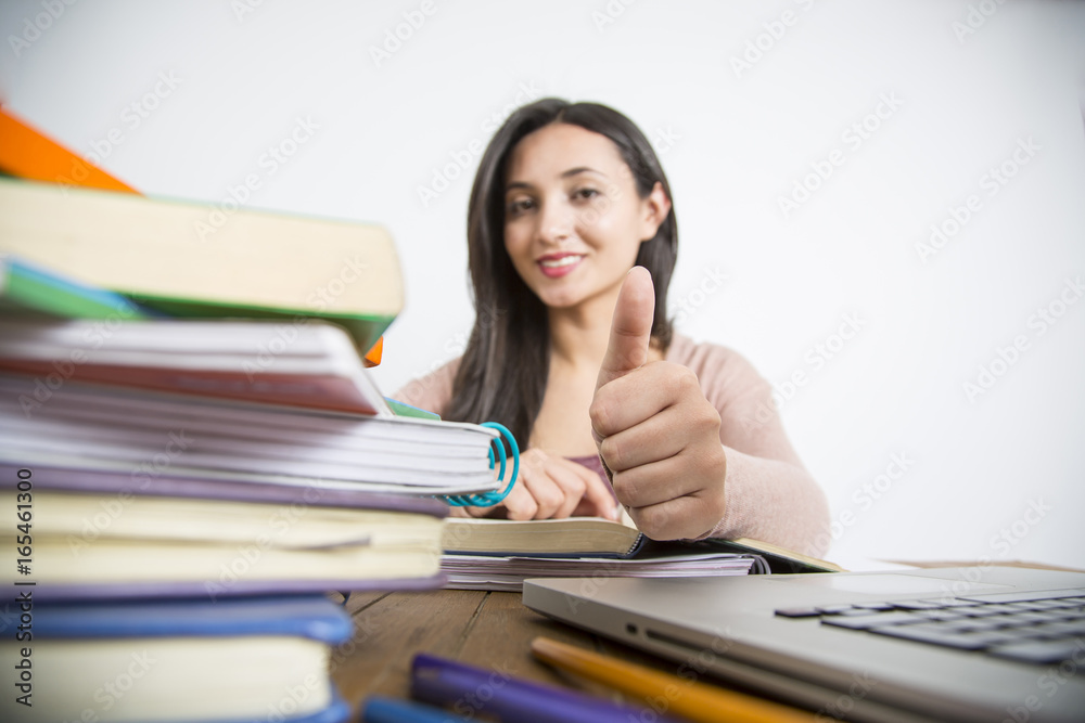 Female student in exams with books Female student in exams with books