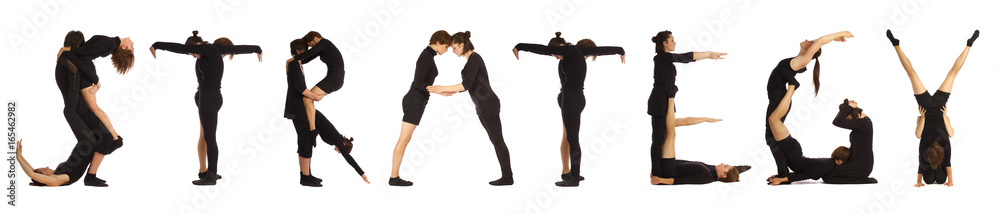 Black dressed people forming STRATEGY word Black dressed people forming STRATEGY word