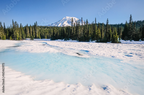 Mount Rainier from a snow-covered Reflection Lake in June
