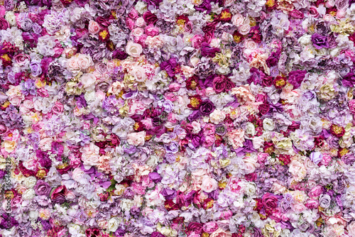 Fototapeta Naklejka Na Ścianę i Meble -  Flower texture background for wedding scene. Roses, peonies and hydrangeas, artificial flowers on the wall.