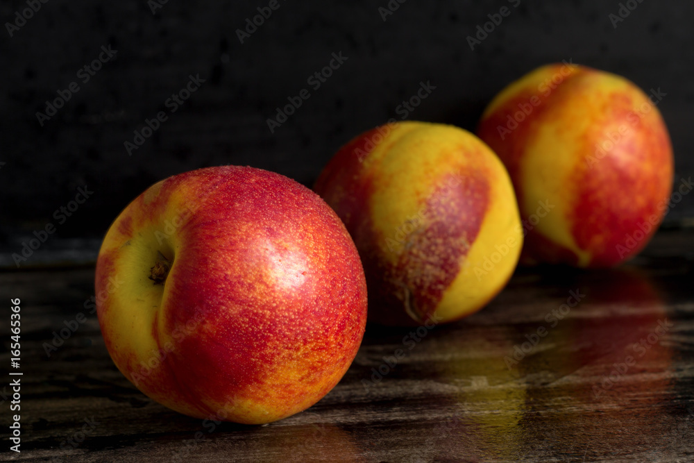 bright fresh juicy peaches on a dark background bright fresh juicy peaches on a dark background