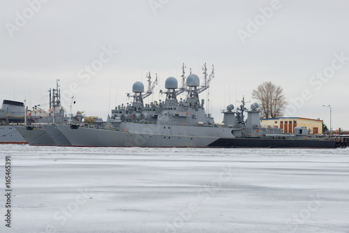 Small anti-submarine ships of the Baltic Navy in winter parking on a gloomy January day. Kronstadt