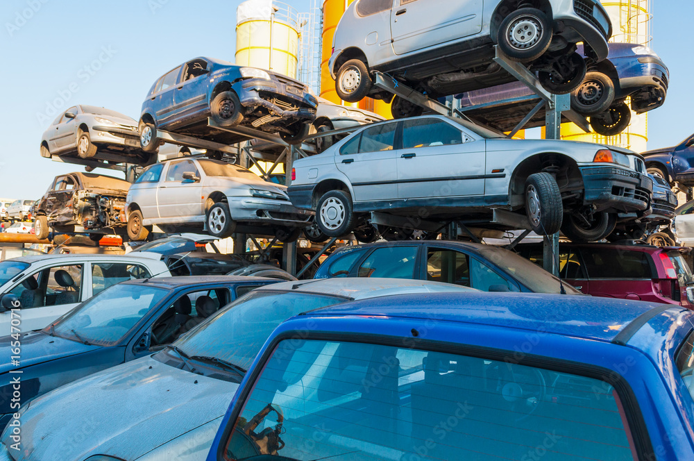 Cars stacked in a car breaker junkyard