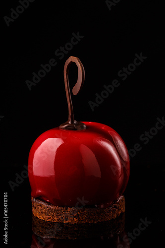 Glossy mousse cakes in the form of cherries photo