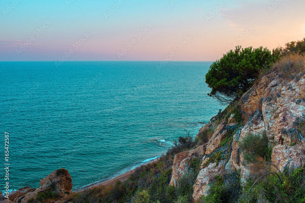 Sunrise on the beach of Calella near Barcelona, Catalonia, Spain Sunrise on the beach of Calella near Barcelona, Catalonia, Spain