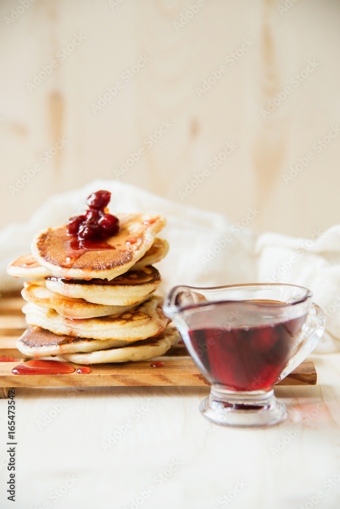 Stack of pancakes with jam and sugar Stack of pancakes with jam and sugar