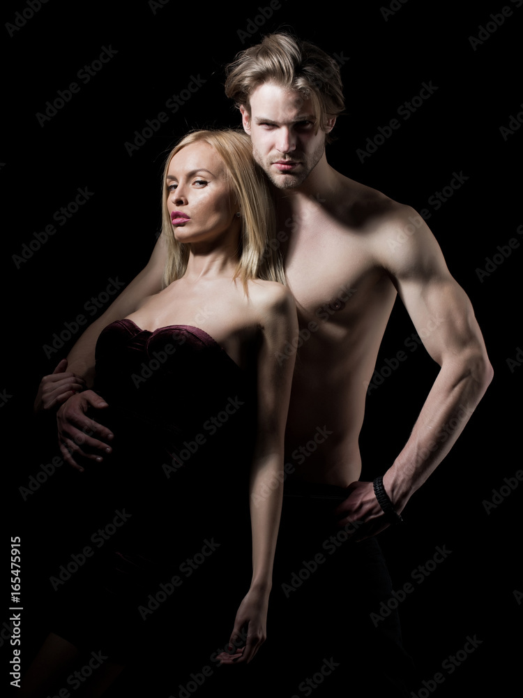 Man with muscular body with sexy girl. Man with muscular body with sexy girl.