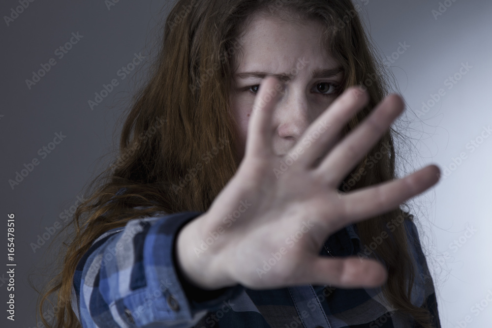 Young beautiful woman showing stop hand sign gesture (Body language, gestures, psychology) Young beautiful woman showing stop hand sign gesture (Body language, gestures, psychology)