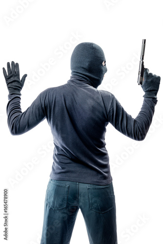 Criminal terrorist with hands up isolated on white background