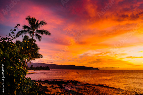Fototapeta Naklejka Na Ścianę i Meble -  Sunset over North Shore Oahu Hawaii over ocean