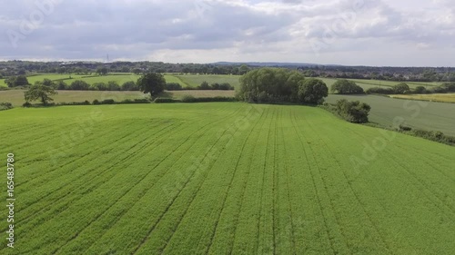 Aerial footage flying over Welsh farm land and trees near Hawarden North Wales. photo