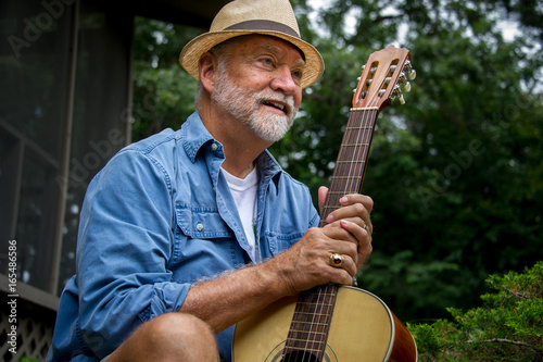 senior man with guitar