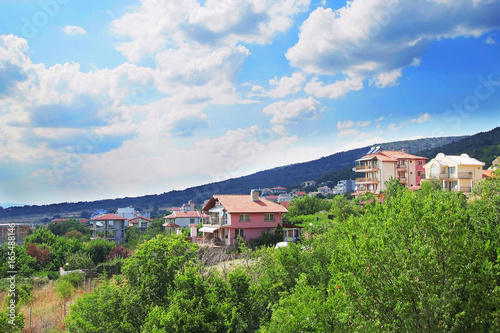 Panorama of the beautiful houses and red roofs of the Balkan mountains nature Bulgaria summer resort