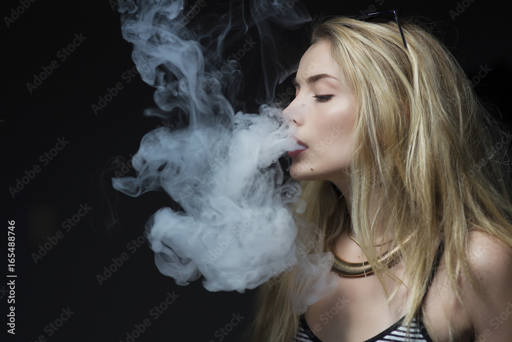young female vaping electronic cigarette