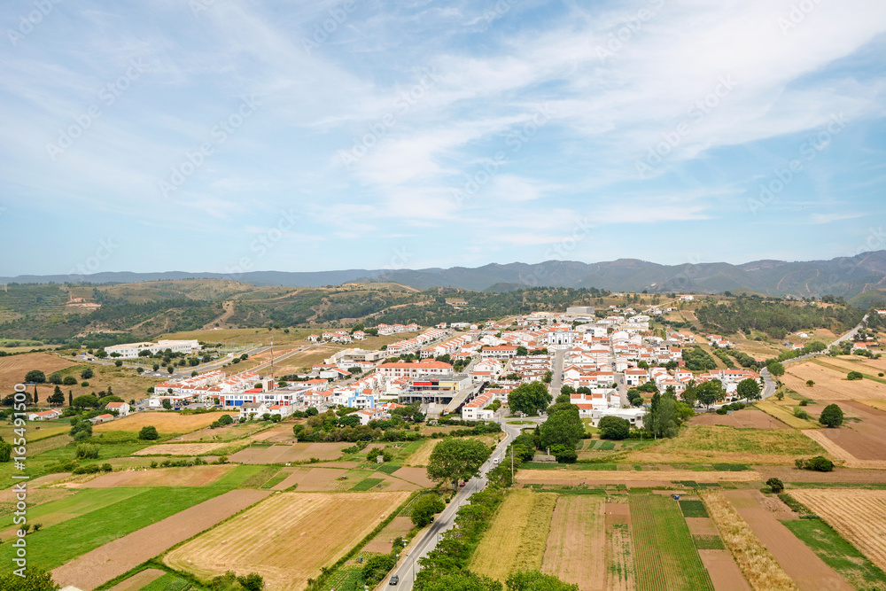 View to the small town of Aljezur with traditional portuguese houses and rural landscape, Algarve Portugal