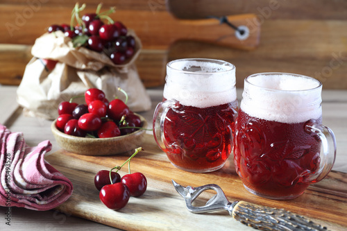 фотографія Light fruit craft beer and cherry, rustic style