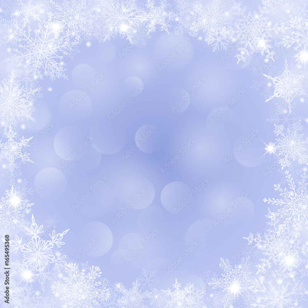 Christmas background with frame of snowflakes and bokeh effect in light blue Christmas background with frame of snowflakes and bokeh effect in light blue