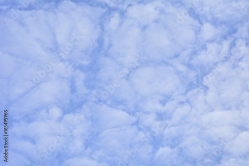 Background of high icy clouds against the blue sky.