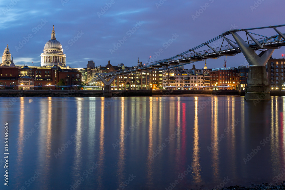 Night photo of Millennium Bridge and  St. Paul Cathedral, London, Great Britain