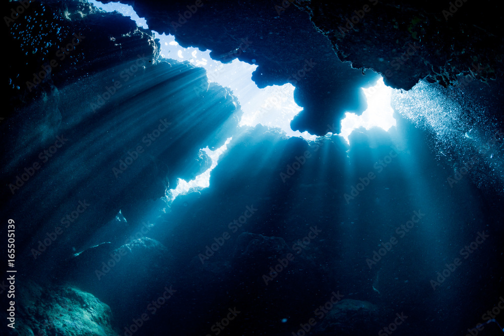 Rays of sunlight into the underwater cave
