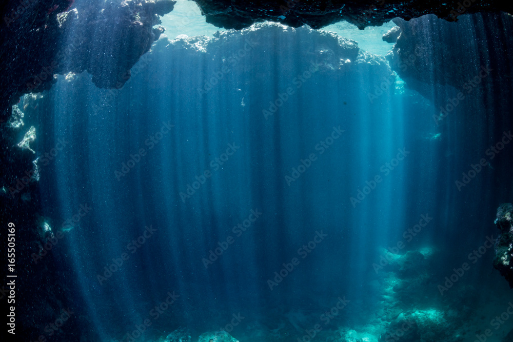 Rays of sunlight into the underwater cave

