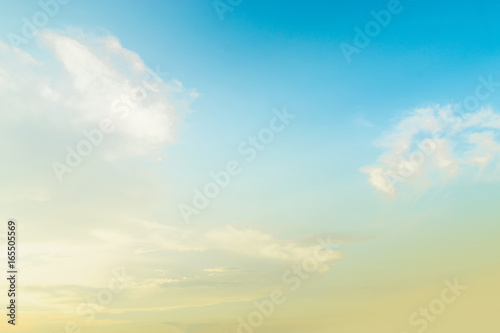 The blue backdrop has some clouds.