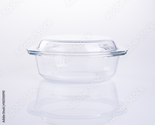 glass pot or glass casserole with lid for baking on a background.