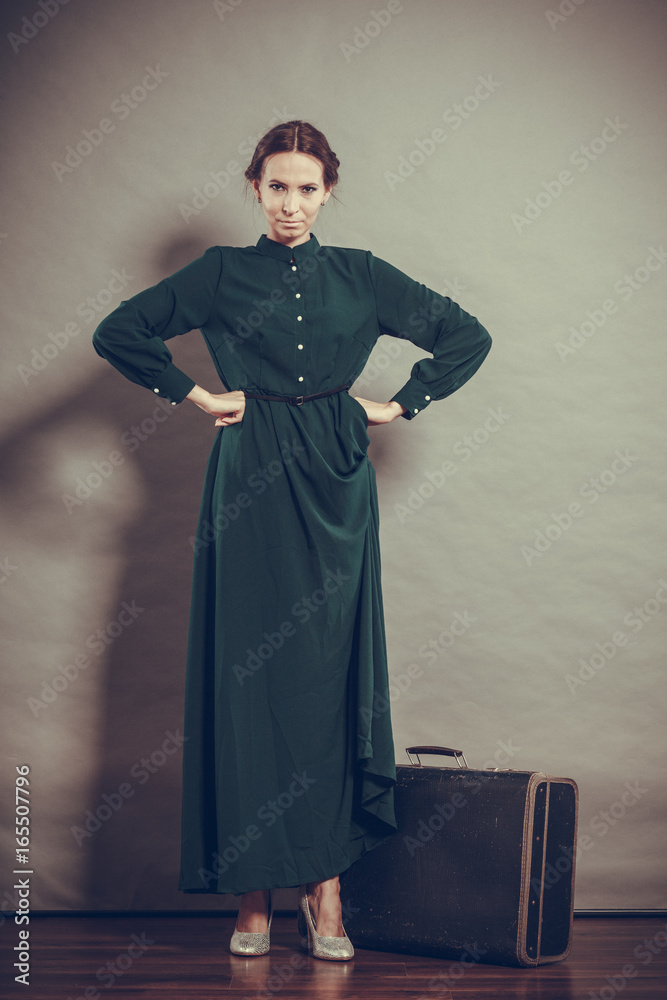 Woman retro style with old suitcase