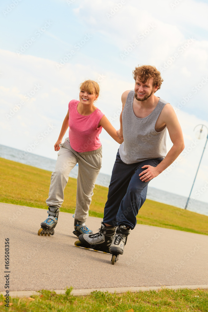Fototapeta premium roller skater couple skating outdoor
