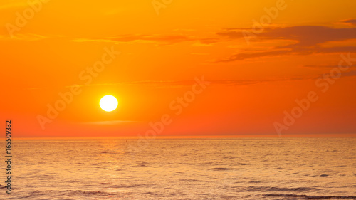 Fototapeta Naklejka Na Ścianę i Meble -  Idyllic shot of sunset by the sea