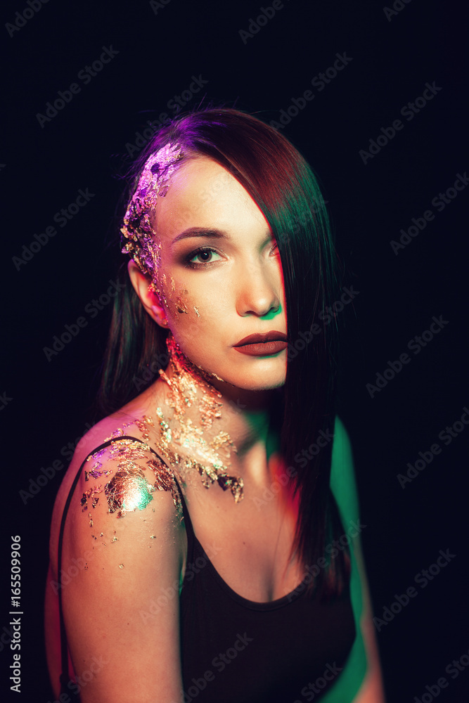 Fototapeta premium Portrait of a girl on a black background