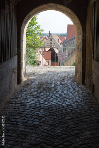 city gate and wall with buildings details photo