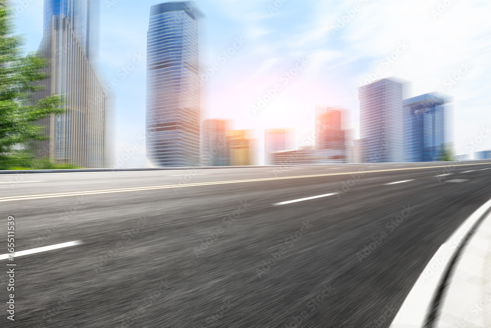 Motion blur asphalt road and modern buildings in shanghai