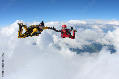 Tableau sur toile Two skydivers are in the sky.