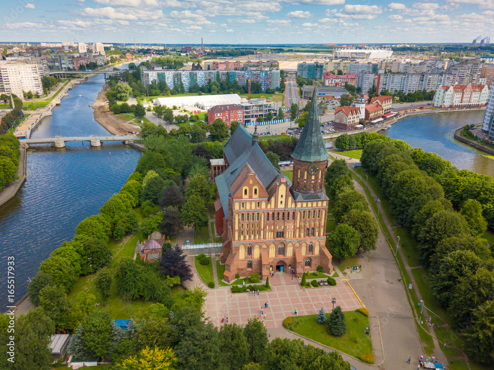 Obraz premium Aerial cityscape of Kant Island in Kaliningrad, Russia at sunny summer day with white clouds in the blue sky