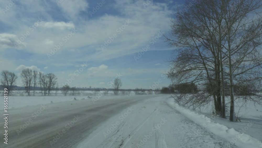 car moving on winter road at blizzard
car moving on winter road at blizzard