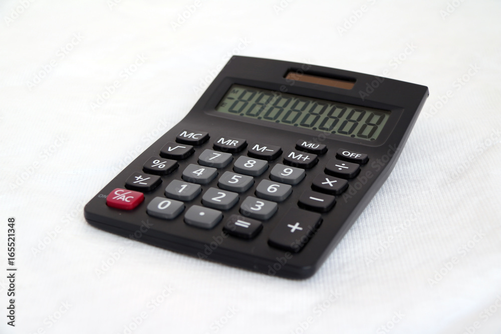 Black calculator on white background. It is something used for making mathematical calculations, in particular a small electronic device with a keyboard and a visual display. Black calculator on white background. It is something used for making mathematical calculations, in particular a small electronic device with a keyboard and a visual display.