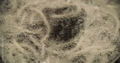 close-up of fluidized roasting vegetables in oil on the fried food in the restaurant photo