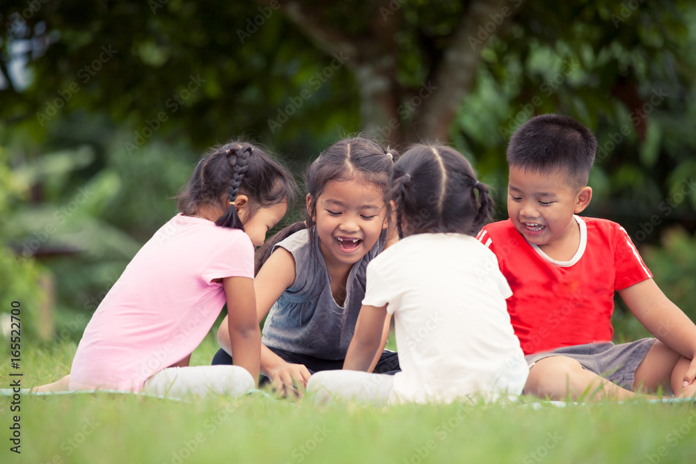 Happy children playing and having fun together in outdoor in summer time Happy children playing and having fun together in outdoor in summer time