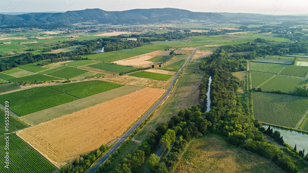 Aerial top view of Canal du Midi and vineyards from above, beautiful rural  countryside landscape of Southern France

