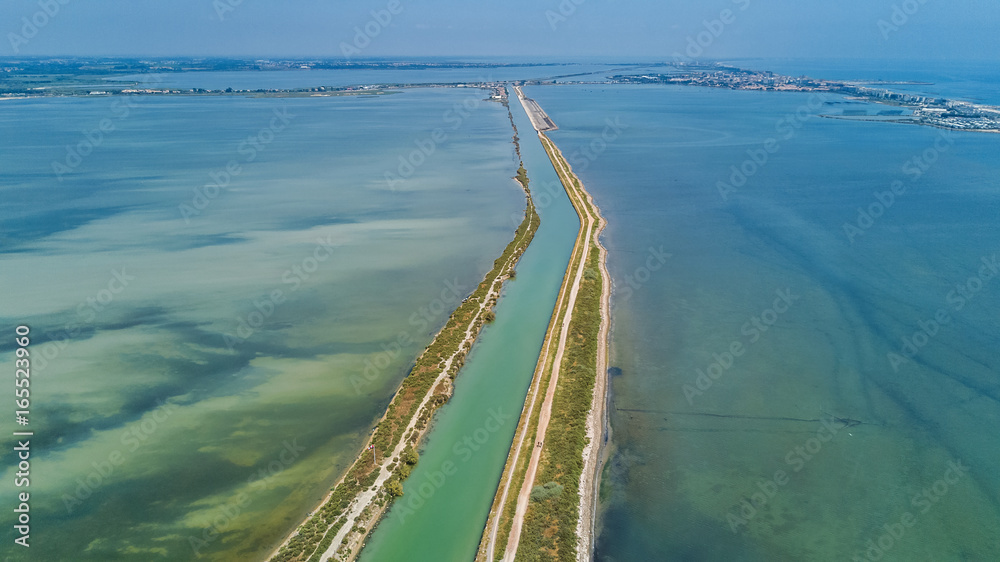 Aerial view of canal in lagoon of Mediterranean sea Etang de Thau water from above, South France
Aerial view of canal in lagoon of Mediterranean sea Etang de Thau water from above, South France
