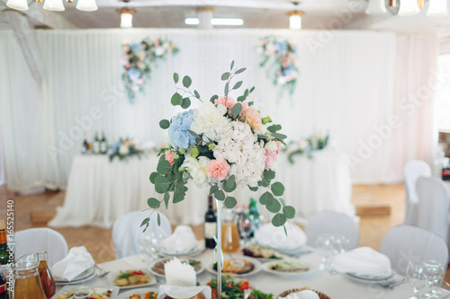 The vase with flowers stands on the table © myronovychoksana