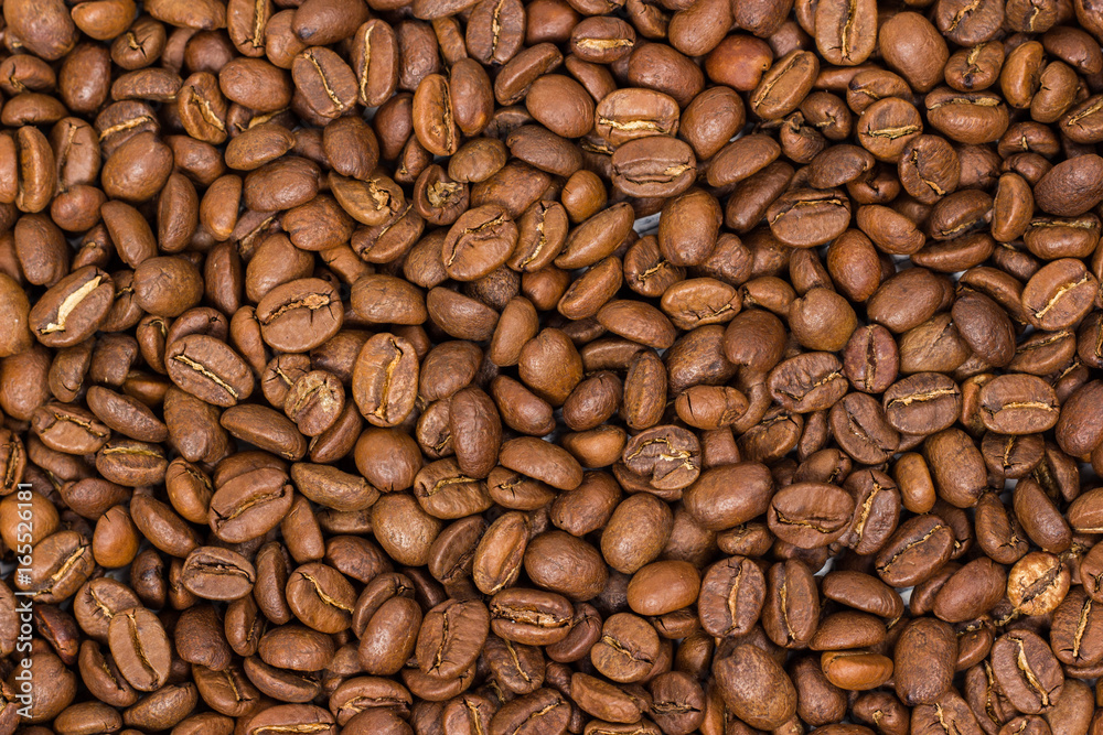 Coffee texture. coffee beans as background wallpaper. arabica cofee bean Coffee texture. coffee beans as background wallpaper. arabica cofee bean