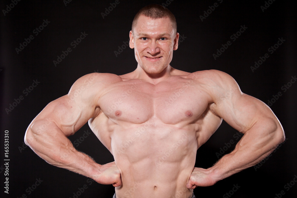 Sport the athlete bodybuilder shows off his muscles Sport the athlete bodybuilder shows off his muscles