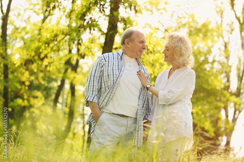 Happy senior couple walking...