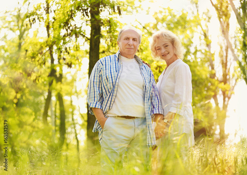 Happy senior couple walking...