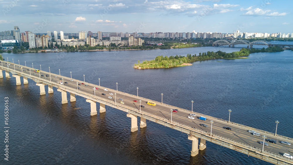 Aerial top view of Paton bridge and Dnieper river from above, city of Kiev, Ukraine
