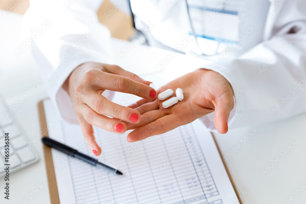 © nenetus - Female doctor giving you a pill. © nenetus - Female doctor giving you a pill.