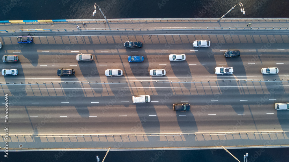 Aerial top view of bridge road automobile traffic of many cars, transportation concept
Aerial top view of bridge road automobile traffic of many cars, transportation concept