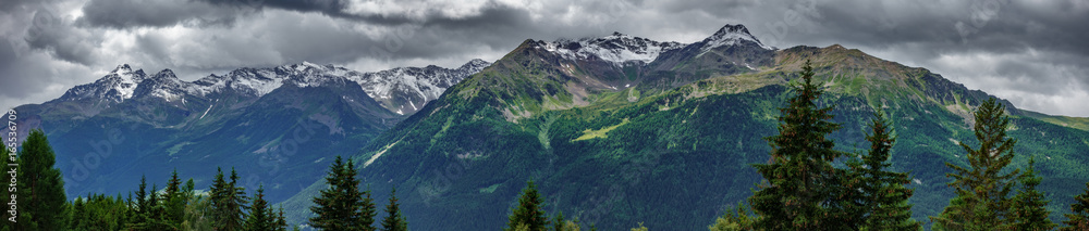 Ultra wide panorama of top of mountains in Italian Alps